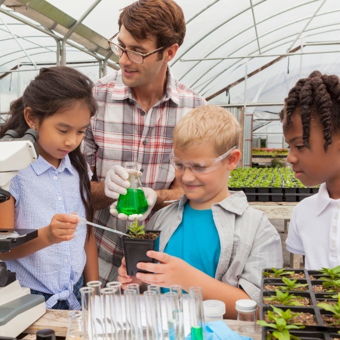 Children learning biology with their teacher